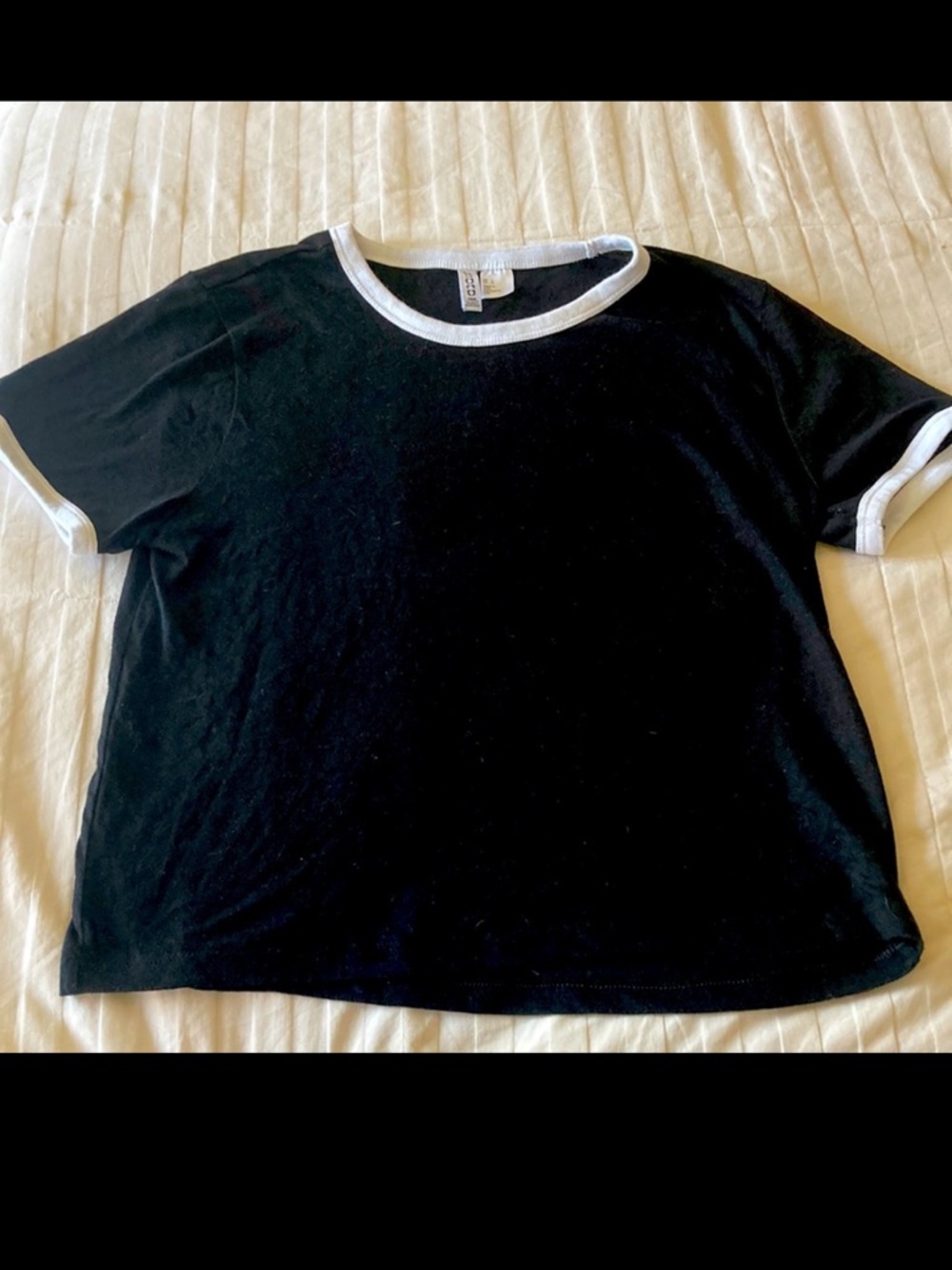 Divided H&M short sleeve tee. Black w/white hem at arms + neck. Size L. EUC